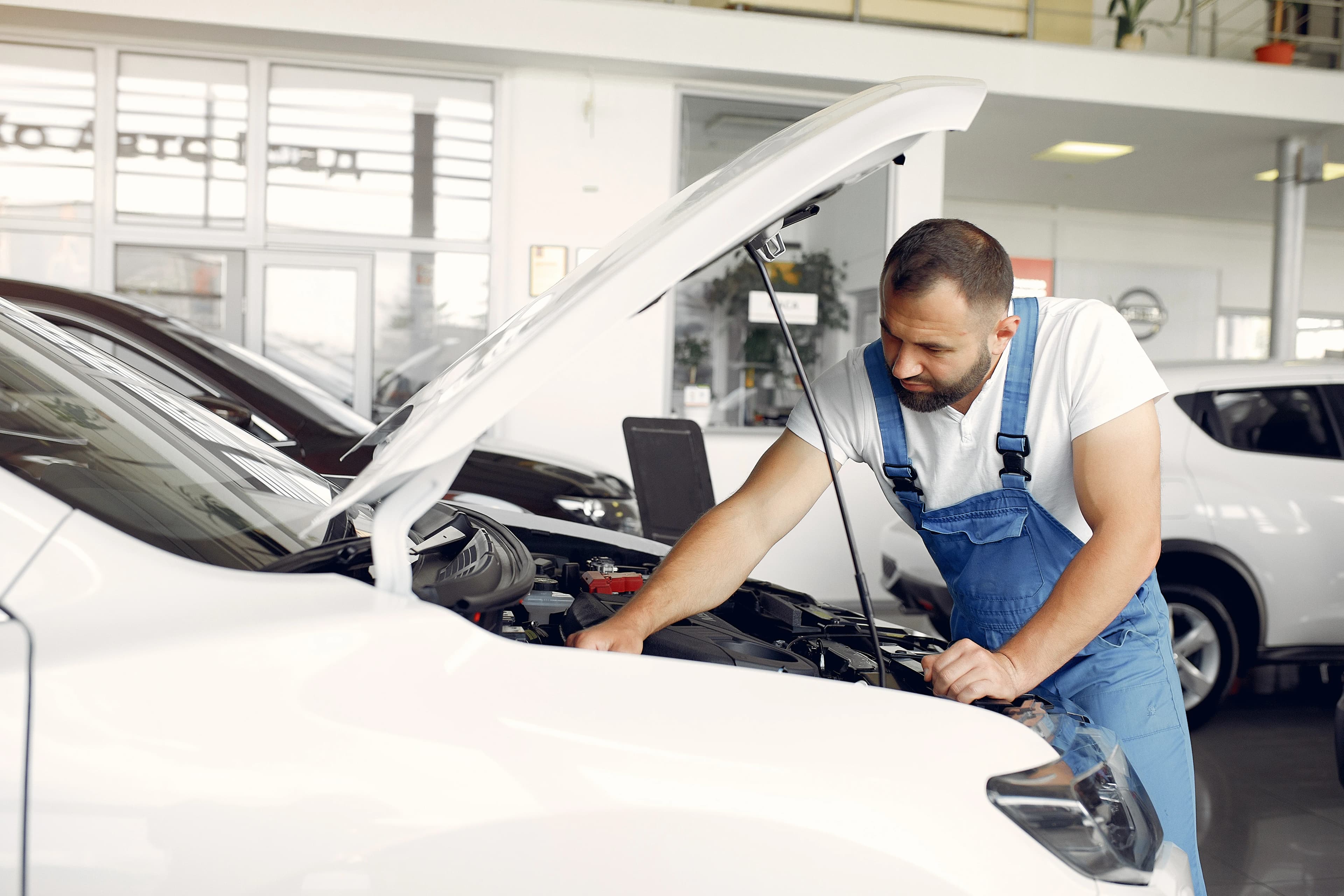 Auto technician inspecting a vehicle